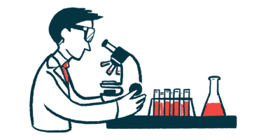 A researcher looks at samples through a microscope.