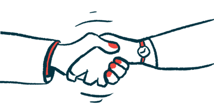 A close-up view of two hands clasped in a handshake.