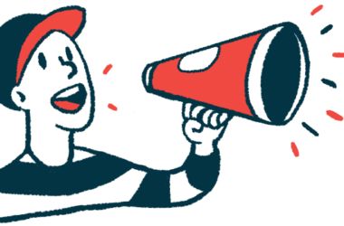 A person wearing a baseball cap speaks through a megaphone cone.