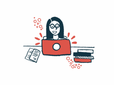 A researcher works on a laptop, with a stack of books and research papers nearby.