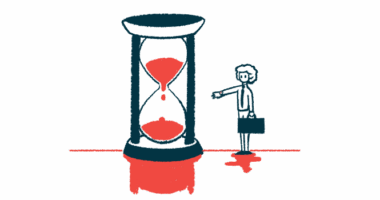 A person carrying a briefcase reaches out a hand toward a giant hourglass nearly half full of sand.