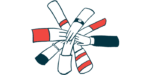 A group of hands joins in a circle.