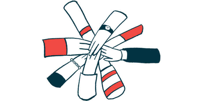 A group of hands joins in a circle.